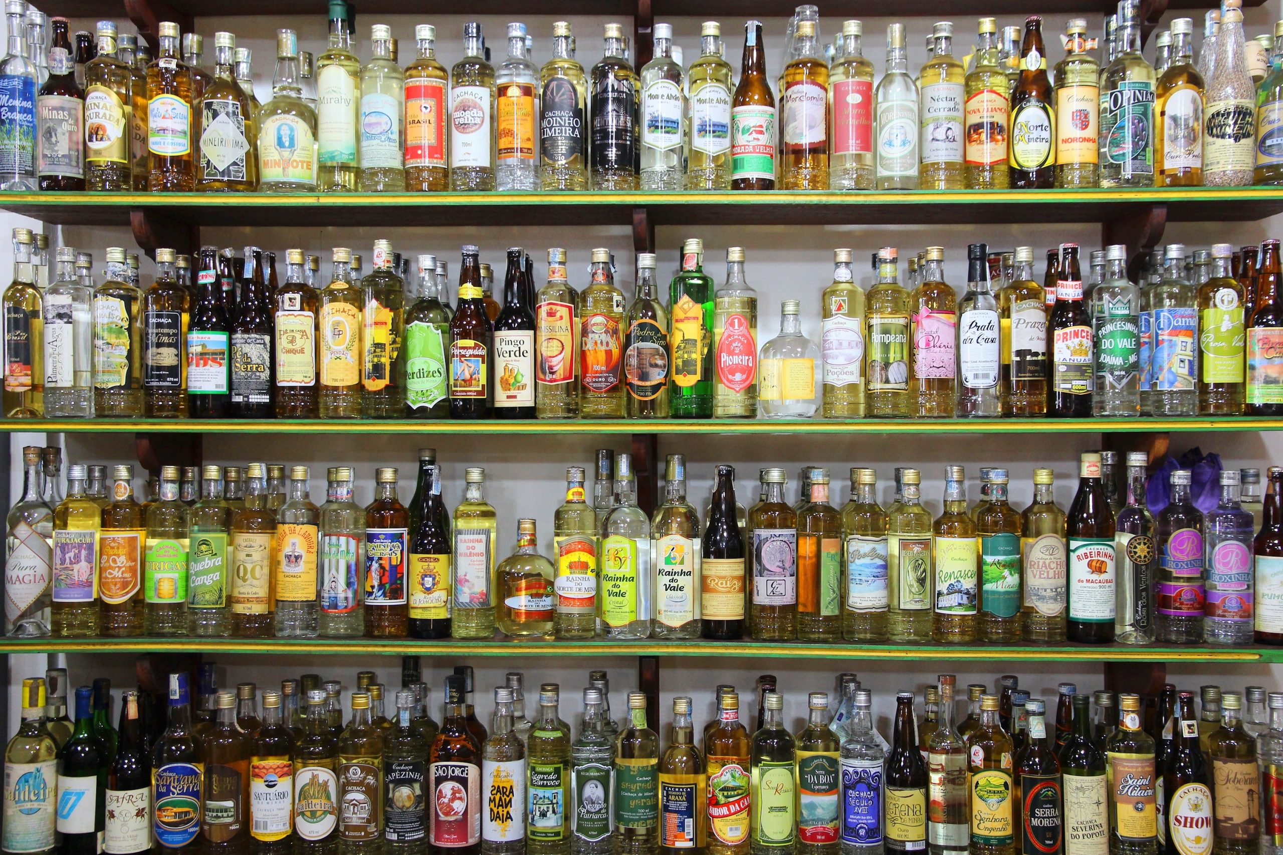 PARATY, BRAZIL – OCTOBER 14, 2014: Cachaca alcohol bottles collection ...